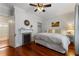 Charming bedroom with hardwood floors, a fireplace, and access to an ensuite bathroom at 22 The Prado Ne, Atlanta, GA 30309