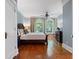 Bright bedroom featuring hardwood floors, blue walls, and large windows at 22 The Prado Ne, Atlanta, GA 30309