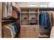 Closet with custom shelving, drawers, and hanging rods providing ample storage for clothing and accessories at 22 The Prado Ne, Atlanta, GA 30309