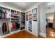 Well-organized walk-in closet with custom shelves, drawers, and easy access to the Primary bedroom at 22 The Prado Ne, Atlanta, GA 30309