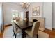 Elegant dining room with hardwood floors, fireplace, chandelier, and large table with seating for eight at 22 The Prado Ne, Atlanta, GA 30309