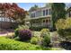 Beautiful home with landscaped front yard, blossoming shrubs, and manicured hedges at 22 The Prado Ne, Atlanta, GA 30309