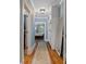 Inviting hallway with hardwood floors, neutral walls, and convenient built-in storage at 22 The Prado Ne, Atlanta, GA 30309