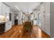 Stylish kitchen with hardwood floors, white cabinetry, stainless appliances and view to dining area at 22 The Prado Ne, Atlanta, GA 30309