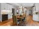Bright kitchen features hardwood floors, white cabinets, built-in wine cooler, and dining nook at 22 The Prado Ne, Atlanta, GA 30309