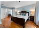 Spacious main bedroom with hardwood floors, a decorative headboard, and blue walls at 22 The Prado Ne, Atlanta, GA 30309