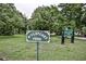 Scenic McClatchey Park entrance with lush greenery, mature trees, and inviting signage at 22 The Prado Ne, Atlanta, GA 30309