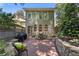 Charming brick patio with seating and grill, creating a cozy outdoor space by a stone garden wall at 22 The Prado Ne, Atlanta, GA 30309
