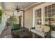 Inviting covered porch with comfortable seating, ceiling fan, and serene outdoor ambiance at 22 The Prado Ne, Atlanta, GA 30309