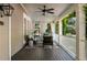 Relaxing covered porch with comfortable seating, ceiling fan, and charming vintage details at 22 The Prado Ne, Atlanta, GA 30309