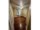 Bedroom with hardwood floors, a ceiling fan, and a window with sheer curtains at 2347 Fawn Hollow Ct, Duluth, GA 30096