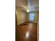Bedroom with hardwood floors, a ceiling fan, and a window with sheer curtains at 2347 Fawn Hollow Ct, Duluth, GA 30096