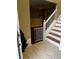 Entryway with staircase and view into the living room; baby gate at 2347 Fawn Hollow Ct, Duluth, GA 30096
