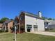 Exterior home view showcasing siding, roof and partial brick facade with an attached garage at 2347 Fawn Hollow Ct, Duluth, GA 30096