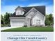 Beautiful French Country home with stone accents, lush landscaping, and a three-car garage at 267 Mooney Rd, Woodstock, GA 30188
