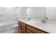 Bathroom featuring double sink vanity with lots of cabinet space and a bathtub with shower at 6100 Marigold Way, Atlanta, GA 30349