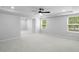 Large bedroom with bright windows, ceiling fan and neutral carpet at 6100 Marigold Way, Atlanta, GA 30349