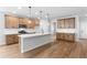 Spacious kitchen with ample wooden cabinets, quartz countertops, and a central island at 6100 Marigold Way, Atlanta, GA 30349