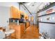 Bright kitchen with stone countertops, wood cabinetry, stainless appliances, and breakfast bar seating at 1596 Cleveland Ave # 204, Atlanta, GA 30344