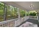 The covered back porch offers great wooded views at 280 Old Carrollton Rd, Carrollton, GA 30116