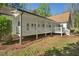 A beautiful backyard featuring a large porch perfect for outdoor entertaining and relaxation at 280 Old Carrollton Rd, Carrollton, GA 30116