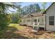 Spacious backyard with a large porch area, perfect for enjoying outdoor living and activities at 280 Old Carrollton Rd, Carrollton, GA 30116