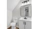 Stylish half bathroom featuring modern vanity, sleek black fixtures, and a contemporary mirror at 280 Old Carrollton Rd, Carrollton, GA 30116