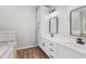 Modern bathroom featuring double sinks, tile floors, and plenty of cabinet space at 280 Old Carrollton Rd, Carrollton, GA 30116