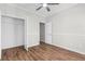 Bright bedroom showcasing hardwood flooring and a modern ceiling fan at 280 Old Carrollton Rd, Carrollton, GA 30116