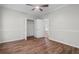 Bedroom showcases hardwood flooring, modern ceiling fan, and closet at 280 Old Carrollton Rd, Carrollton, GA 30116