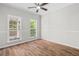 Bedroom showcases hardwood flooring and views of the backyard at 280 Old Carrollton Rd, Carrollton, GA 30116