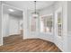 Bright dining nook featuring lots of windows, neutral paint, and hardwood floors at 280 Old Carrollton Rd, Carrollton, GA 30116
