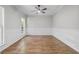 Formal dining room with wood flooring, wainscoting, and a modern ceiling fan at 280 Old Carrollton Rd, Carrollton, GA 30116