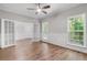 Bright dining room showcasing wood floors, paneled walls, and large windows at 280 Old Carrollton Rd, Carrollton, GA 30116