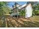 View of home with covered porch and stairs leading to yard at 280 Old Carrollton Rd, Carrollton, GA 30116