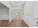 Light-filled foyer with wood flooring, white trim, and views of the living area at 280 Old Carrollton Rd, Carrollton, GA 30116