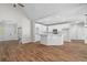 Bright open-concept kitchen featuring hardwood floors, modern appliances, and white cabinets at 280 Old Carrollton Rd, Carrollton, GA 30116