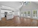 Bright open-concept living space featuring hardwood floors, high ceilings, and white trim at 280 Old Carrollton Rd, Carrollton, GA 30116