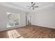 Spacious main bedroom featuring hardwood floors, tray ceilings, and neutral paint at 280 Old Carrollton Rd, Carrollton, GA 30116