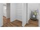 Walk-in storage room with wood floor and shelving near bathroom at 280 Old Carrollton Rd, Carrollton, GA 30116