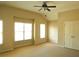 Bright bedroom featuring neutral walls, carpet flooring, and a ceiling fan at 5122 Micaela Way, Duluth, GA 30096