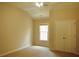 Bedroom with carpet flooring, a ceiling fan, closet doors, and a sunlit window at 5122 Micaela Way, Duluth, GA 30096