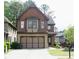 Charming two-story home with brick and shingle exterior, and a spacious two-car garage at 5122 Micaela Way, Duluth, GA 30096