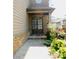 Inviting front entrance with a double door entry and well-maintained landscaping at 5122 Micaela Way, Duluth, GA 30096