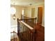 Upstairs hallway with hardwood floors and decorative wrought iron spindles at 5122 Micaela Way, Duluth, GA 30096