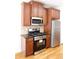 Cozy kitchen featuring stainless steel appliances, wood cabinets and hardwood flooring at 5122 Micaela Way, Duluth, GA 30096