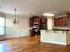 Spacious eat-in kitchen with hardwood floors, stainless steel appliances, and dark wood cabinets at 5122 Micaela Way, Duluth, GA 30096