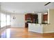 Open concept kitchen with hardwood floors, stainless steel appliances, and dark wood cabinets at 5122 Micaela Way, Duluth, GA 30096