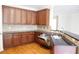 Well appointed kitchen featuring wooden cabinets, granite countertops, and hardwood flooring at 5122 Micaela Way, Duluth, GA 30096