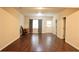 Open living room featuring wood flooring, natural light, and a neutral color scheme at 5122 Micaela Way, Duluth, GA 30096